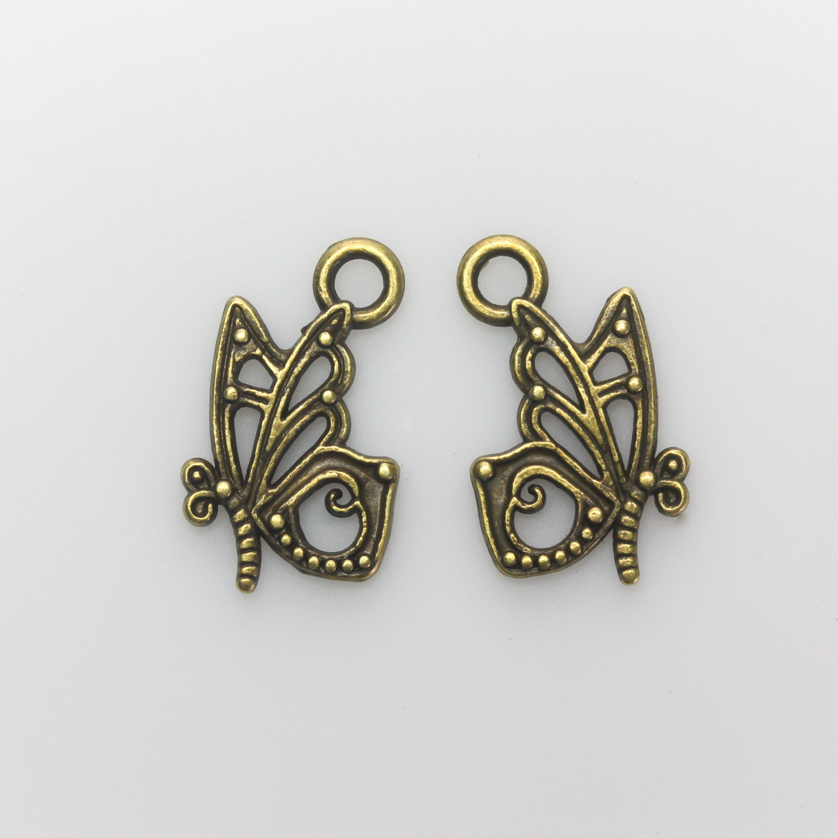 Butterfly charms in an antiqued bronze finish, 16mm long