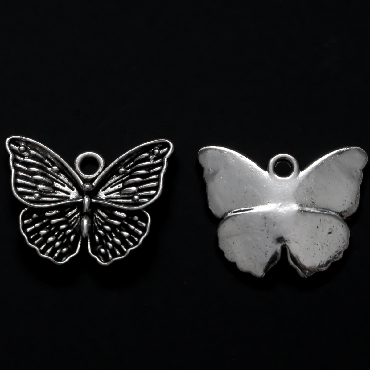 Detailed butterfly charms in an antiqued silver-tone finish, 19.5mm long x 23.5mm wide