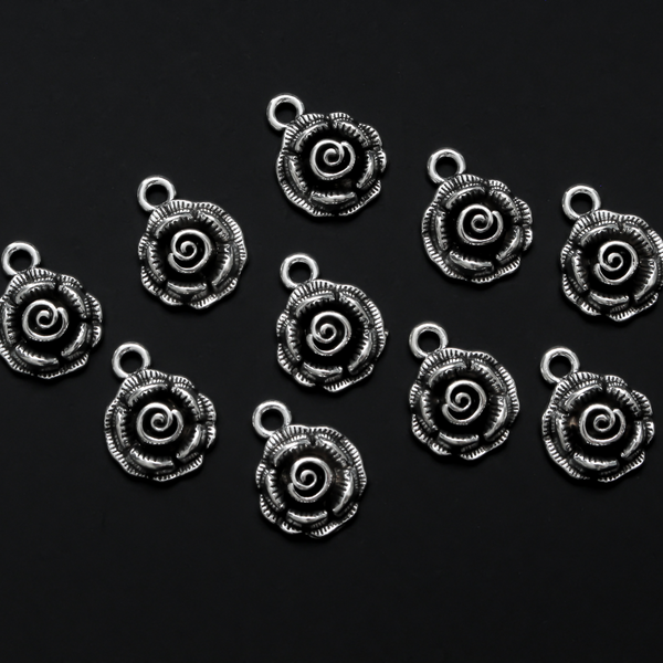 Small round rose charms in an antique silver tone color, 17mm long, 14mm wide, 5mm thick
