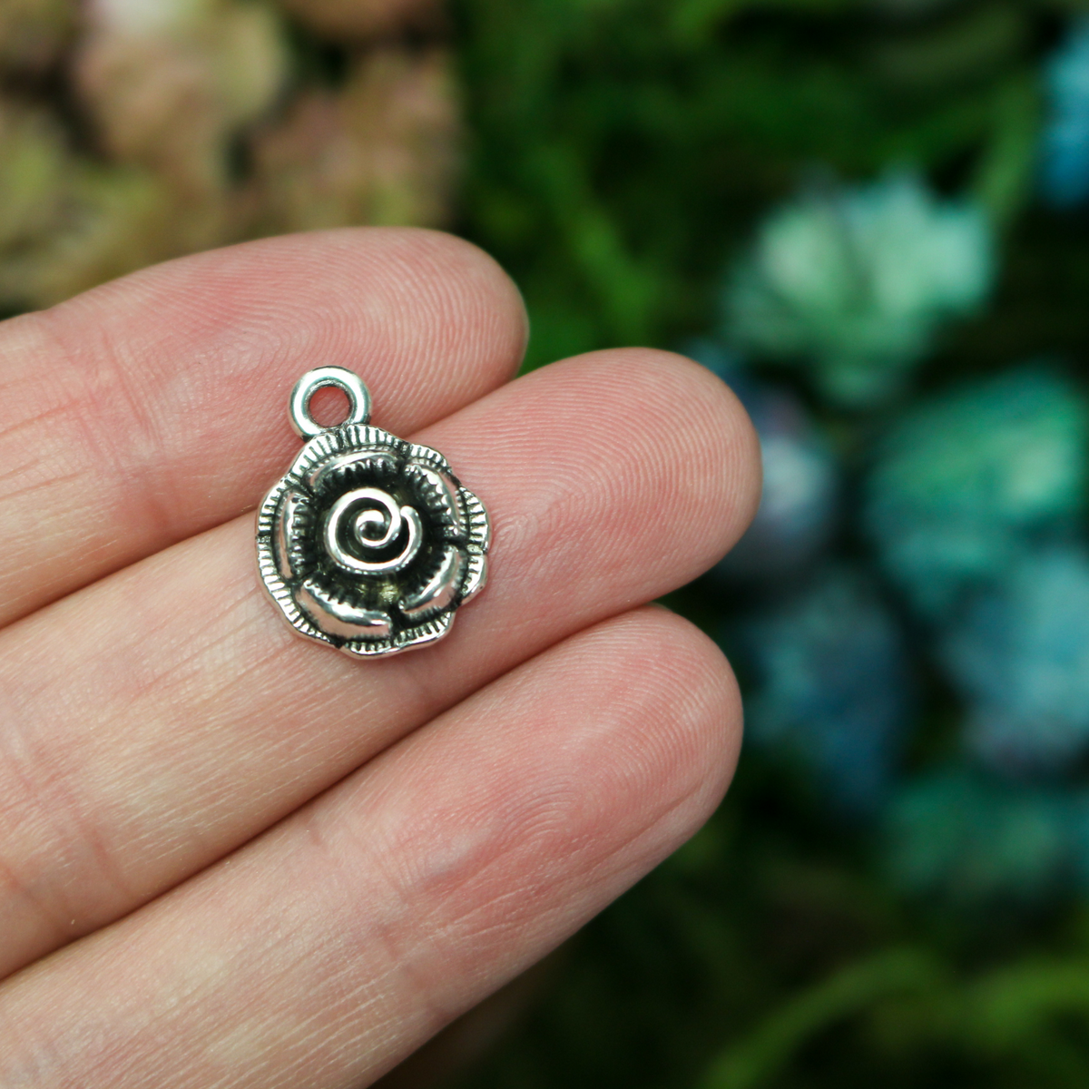 Small round rose charms in an antique silver tone color, 17mm long, 14mm wide, 5mm thick