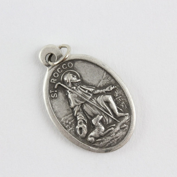 Saint Rocco (Roch) oval medal that depicts the saint on the front and "Pray For Us" on the back