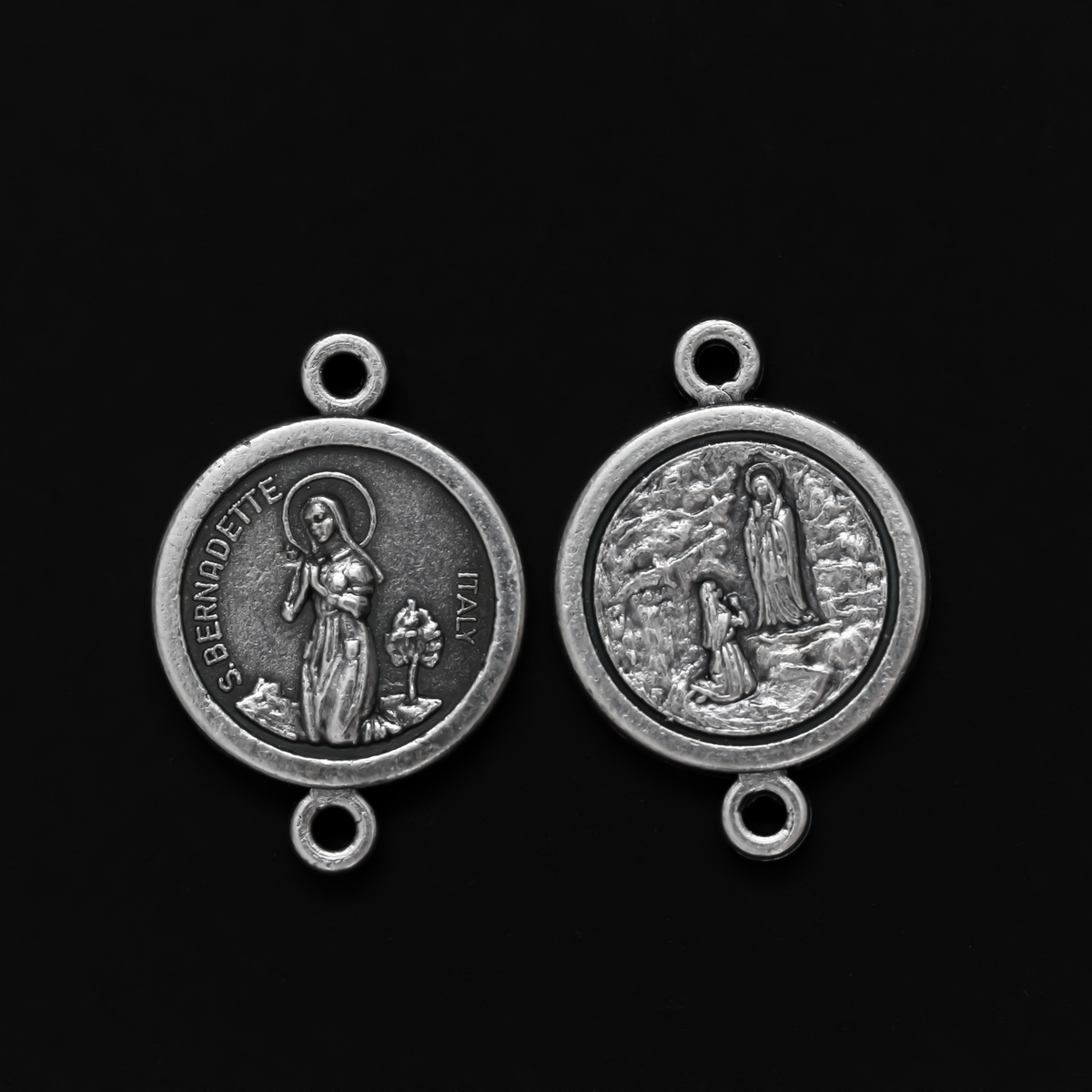 14mm St. Bernadette round flat connector links that are silver oxidized plating on a base metal