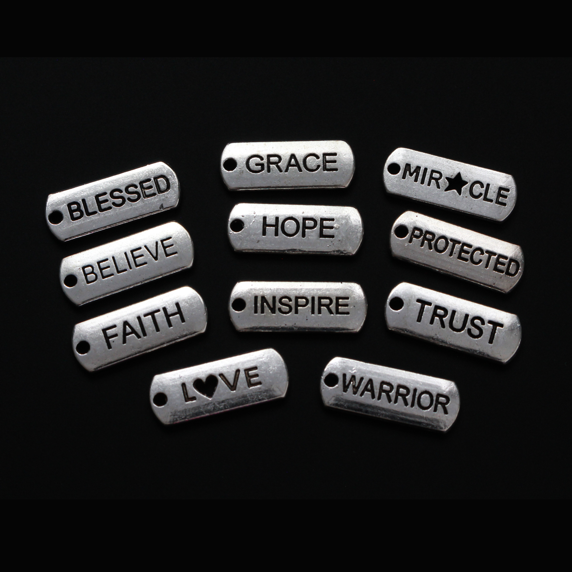 collection of inspirational word charms, eleven pieces