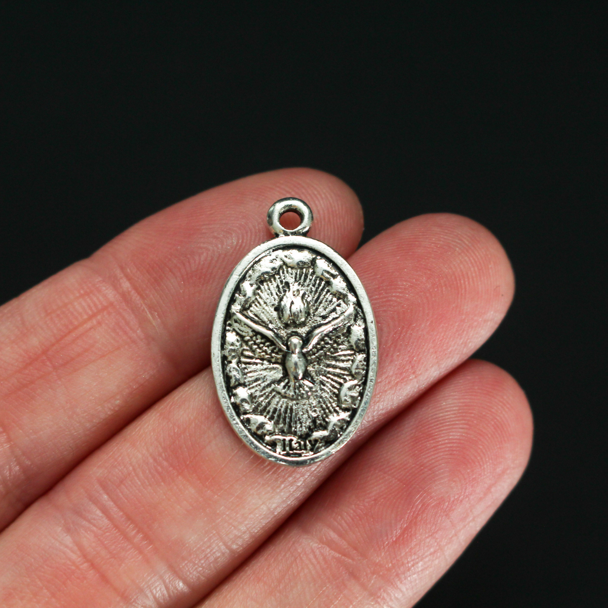 Holy Eucharist with Holy Spirit medal, one inch long silver tone color