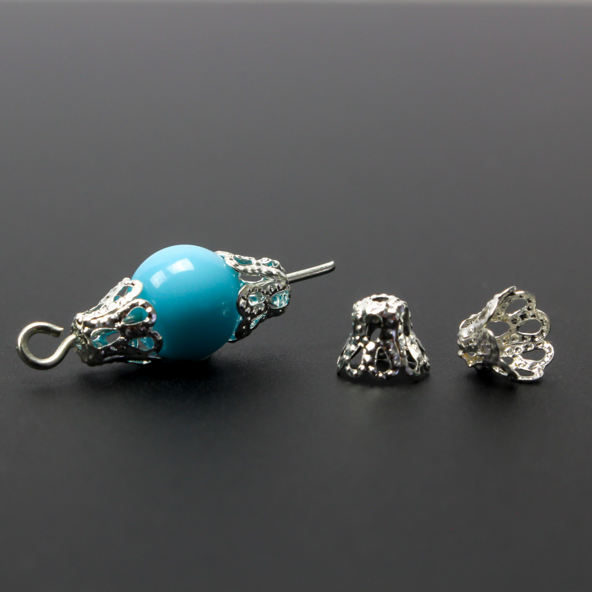 Filigree bead cap cups that are 5mm long by 6mm in diameter at the opening. They can fit beads 6mm - 8mm. Antique silver tone color