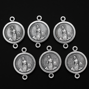 14mm St. Bernadette round flat connector links that are silver oxidized plating on a base metal