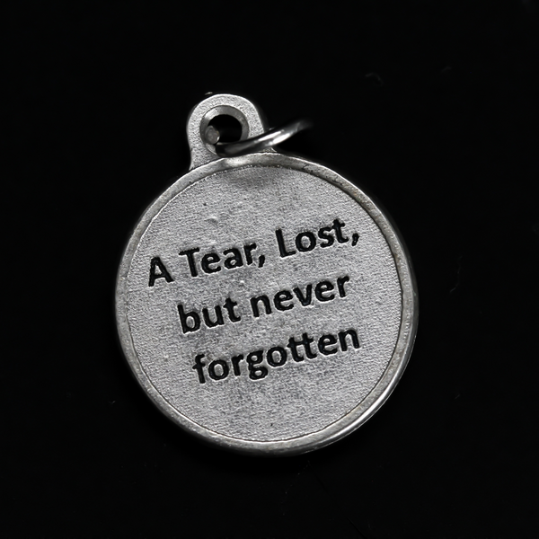 Memorial charm with a teardrop on the front with the words "In Loving Memory" beneath it. The reverse side is marked "A Tear, Lost, but never forgotten". 