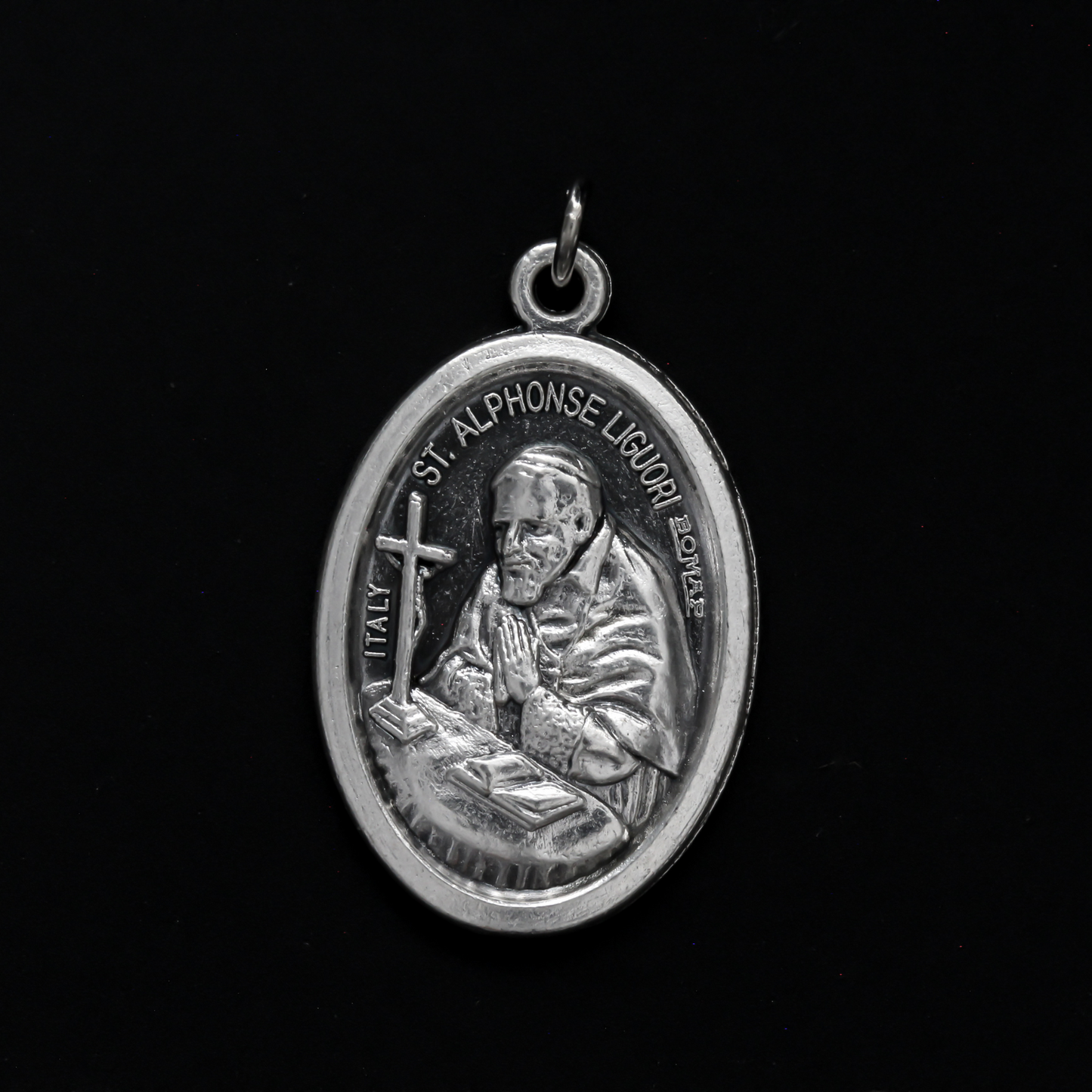 Saint Alphonsus Ligouri one inch oval medal. The front of the medal depicts the Saint and the reverse is marked "Pray For Us"