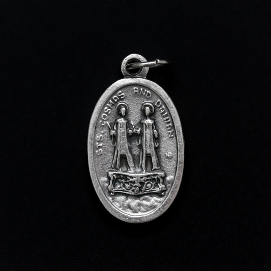 Saints Cosmas and Damian oval medal that depicts the brothers on the front and "Pray For Us" on the back