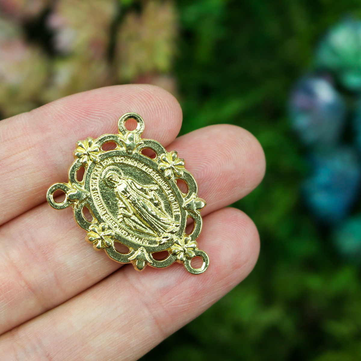 gold tone Miraculous Medal rosary centerpiece that has gorgeous details with filigree cut out design and floral detailing