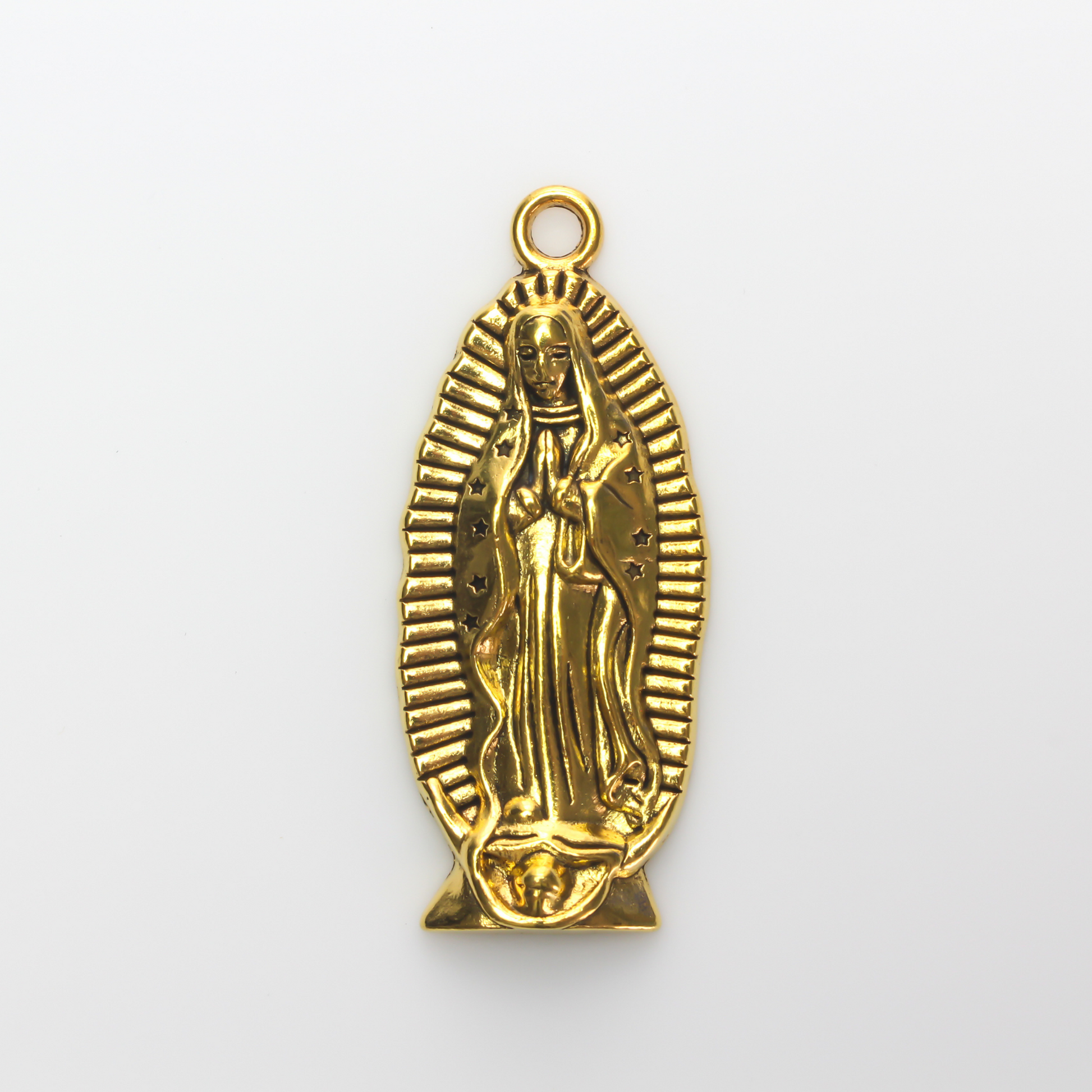 A beautifully detailed pendant of Our Lady of Guadalupe. This large charm is two inches long with a flat, plain back