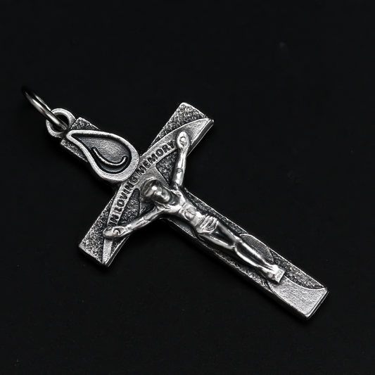 Memorial crucifix cross with a teardrop above Jesus and on the words "In Loving Memory" on the cross beam. The reverse side also is marked "In Loving Memory"