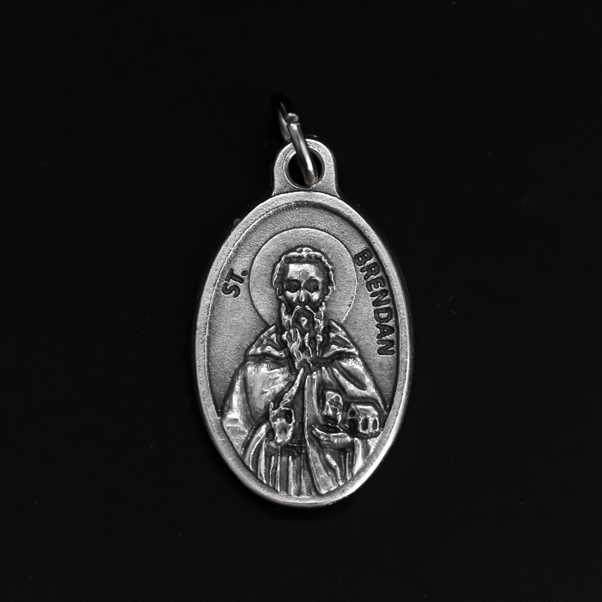 Saint Brendan of Clonfert medal that depicts the saint on the front and "Pray For Us" on the back