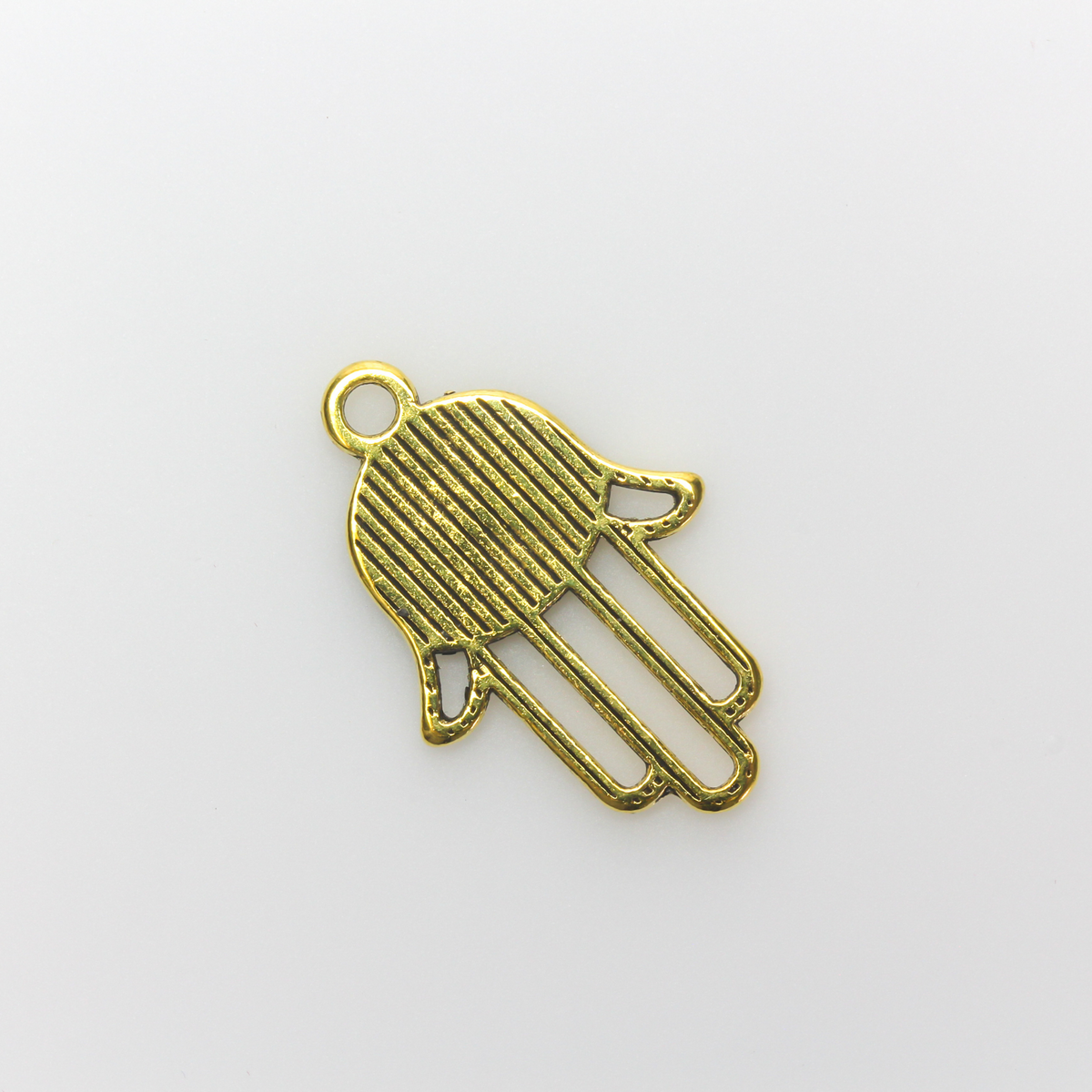 Gold tone Hamsa hand charm with an open design on the fingers, 22mm long by 15mm wide