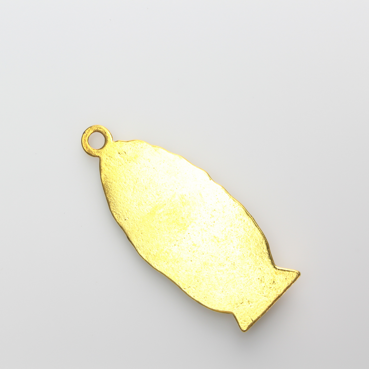 A beautifully detailed pendant of Our Lady of Guadalupe. This large charm is two inches long with a flat, plain back