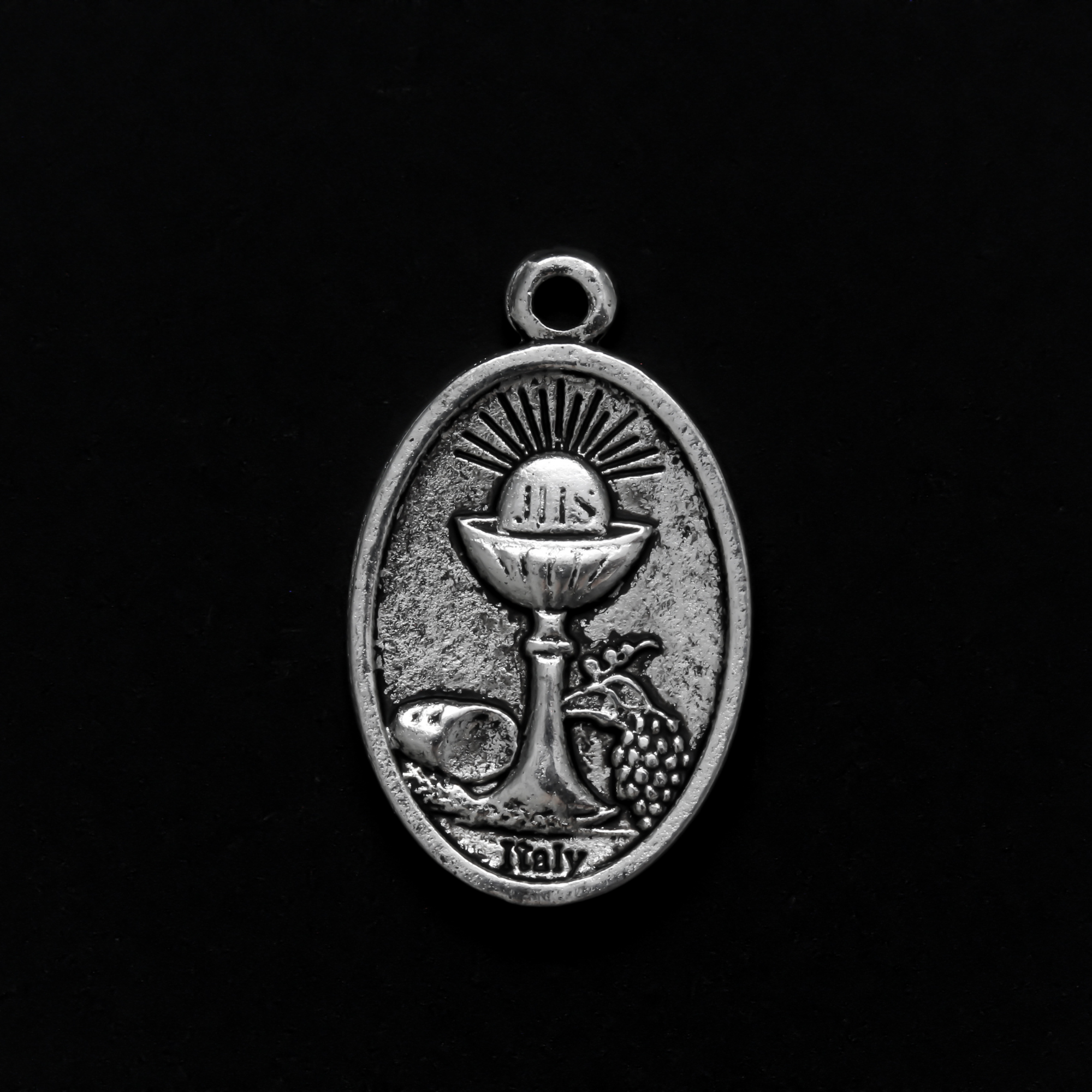Holy Eucharist with Holy Spirit medal, one inch long silver tone color