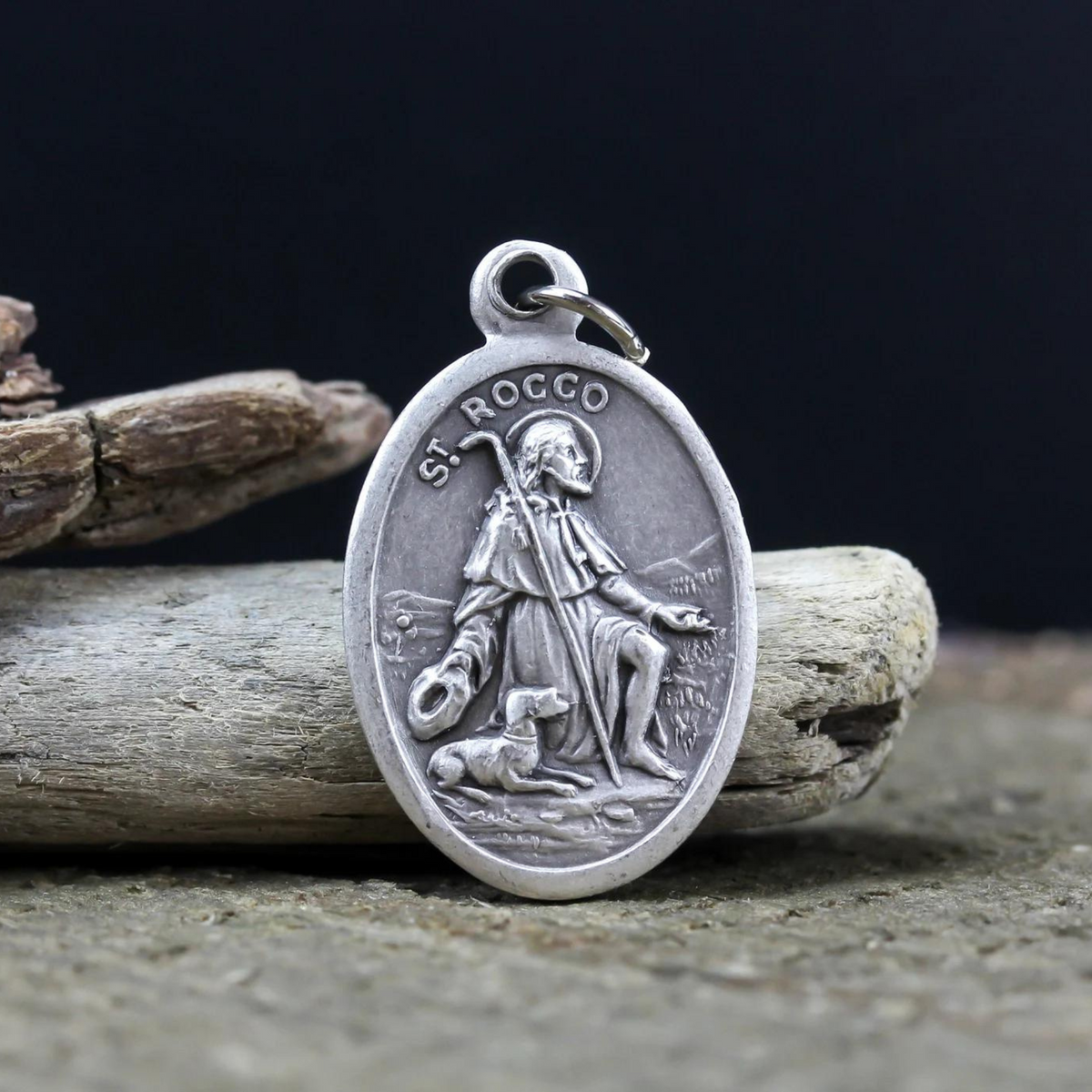 Saint Rocco (Roch) oval medal that depicts the saint on the front and "Pray For Us" on the back