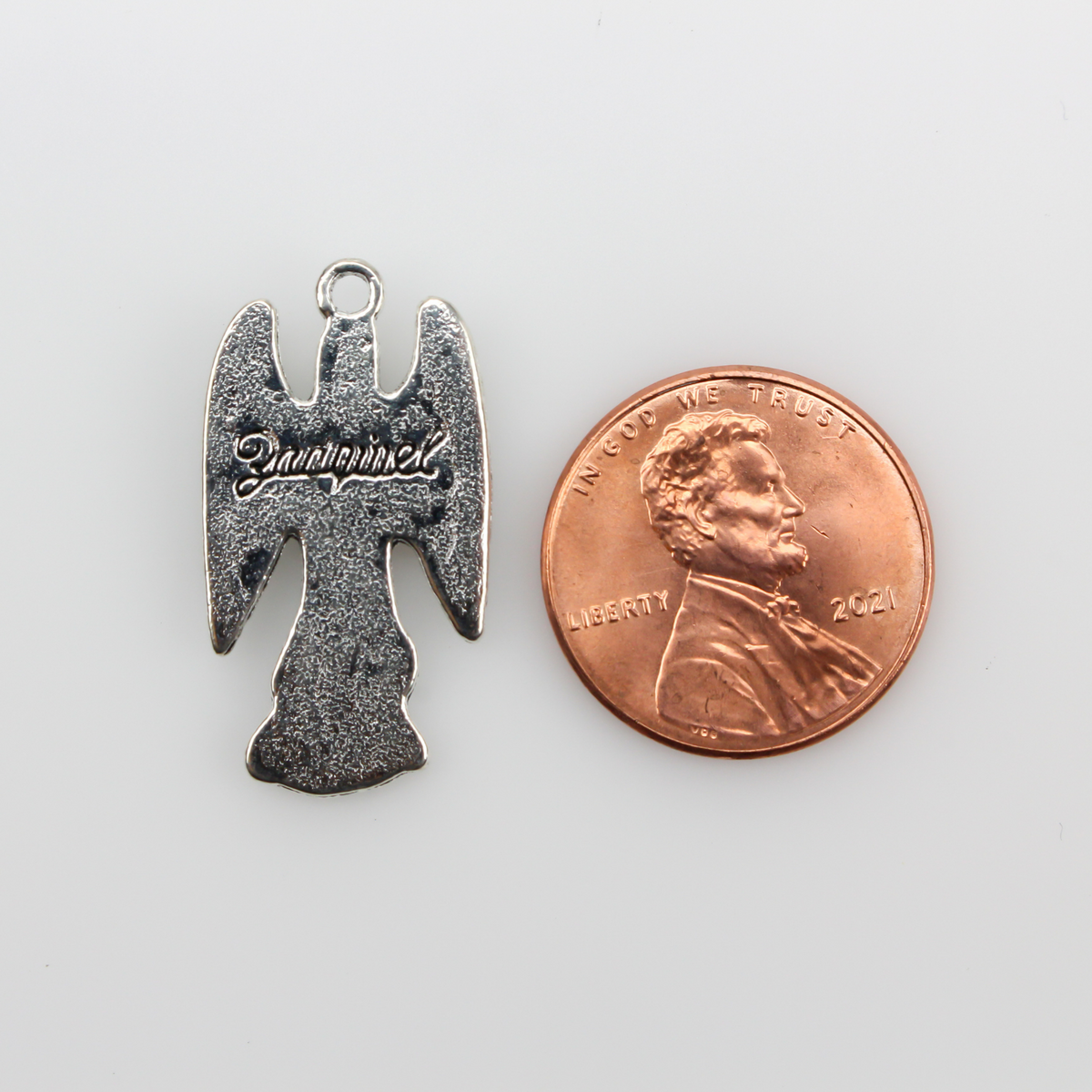 Archangel Zadkiel silver tone charm with his name on the backside inscribed in cursive