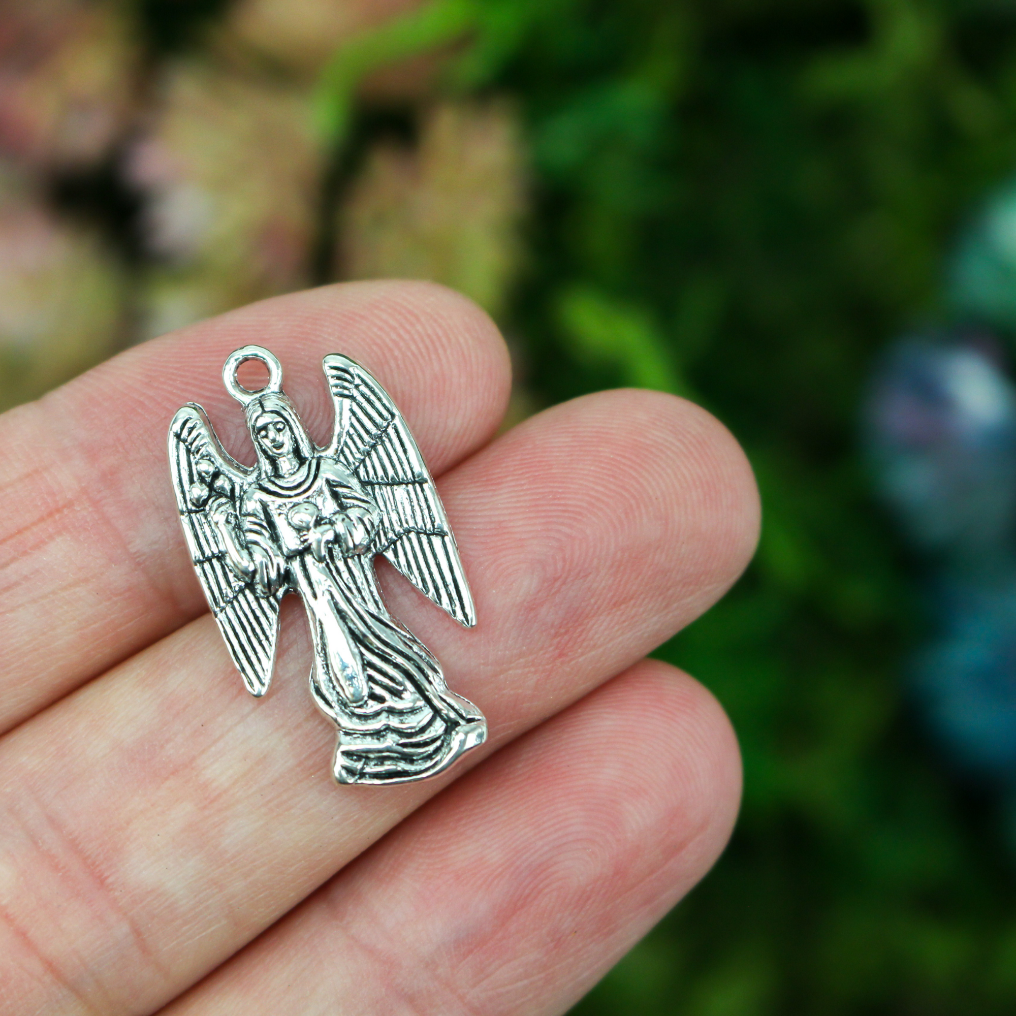 Archangel Zadkiel silver tone charm with his name on the backside inscribed in cursive