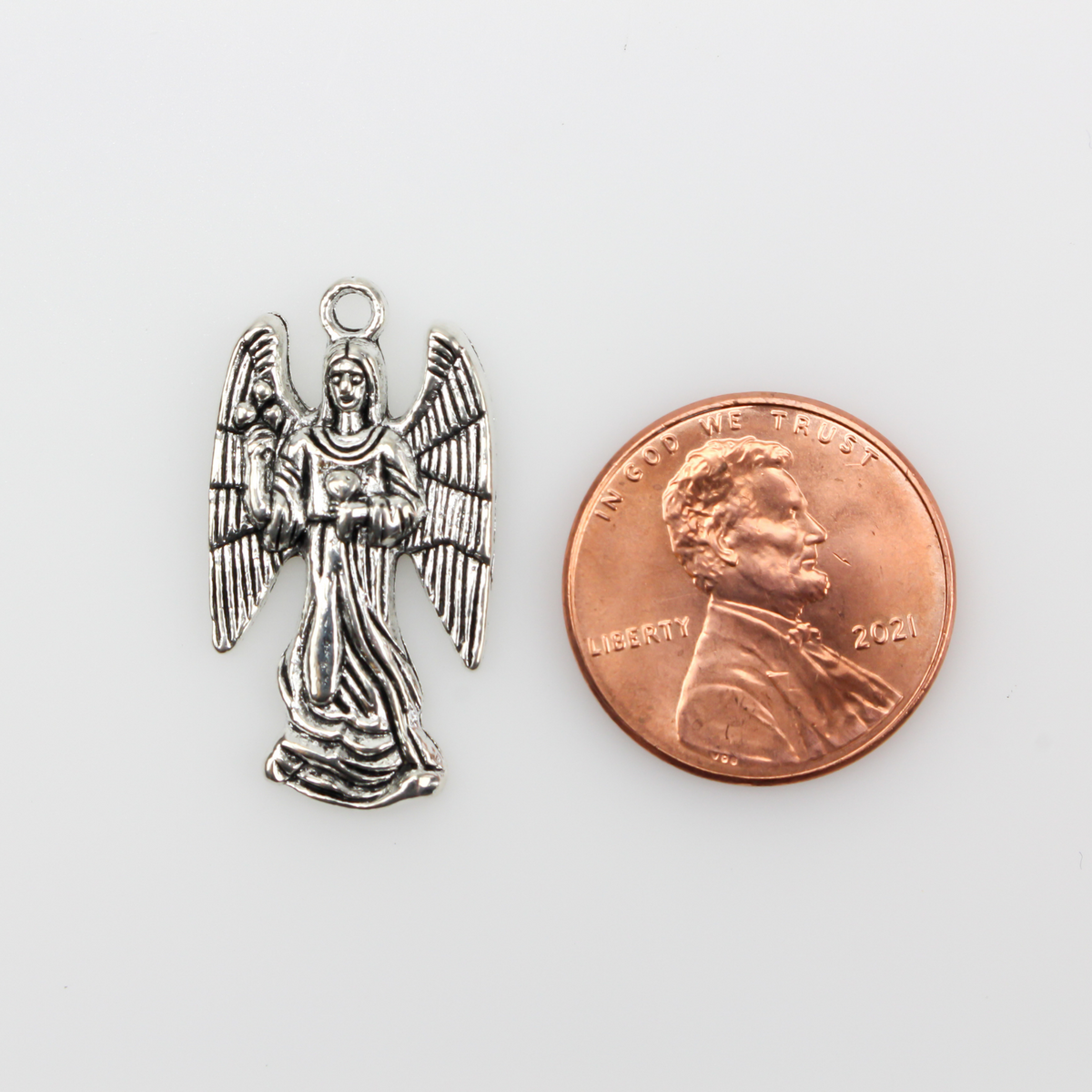 Archangel Zadkiel silver tone charm with his name on the backside inscribed in cursive
