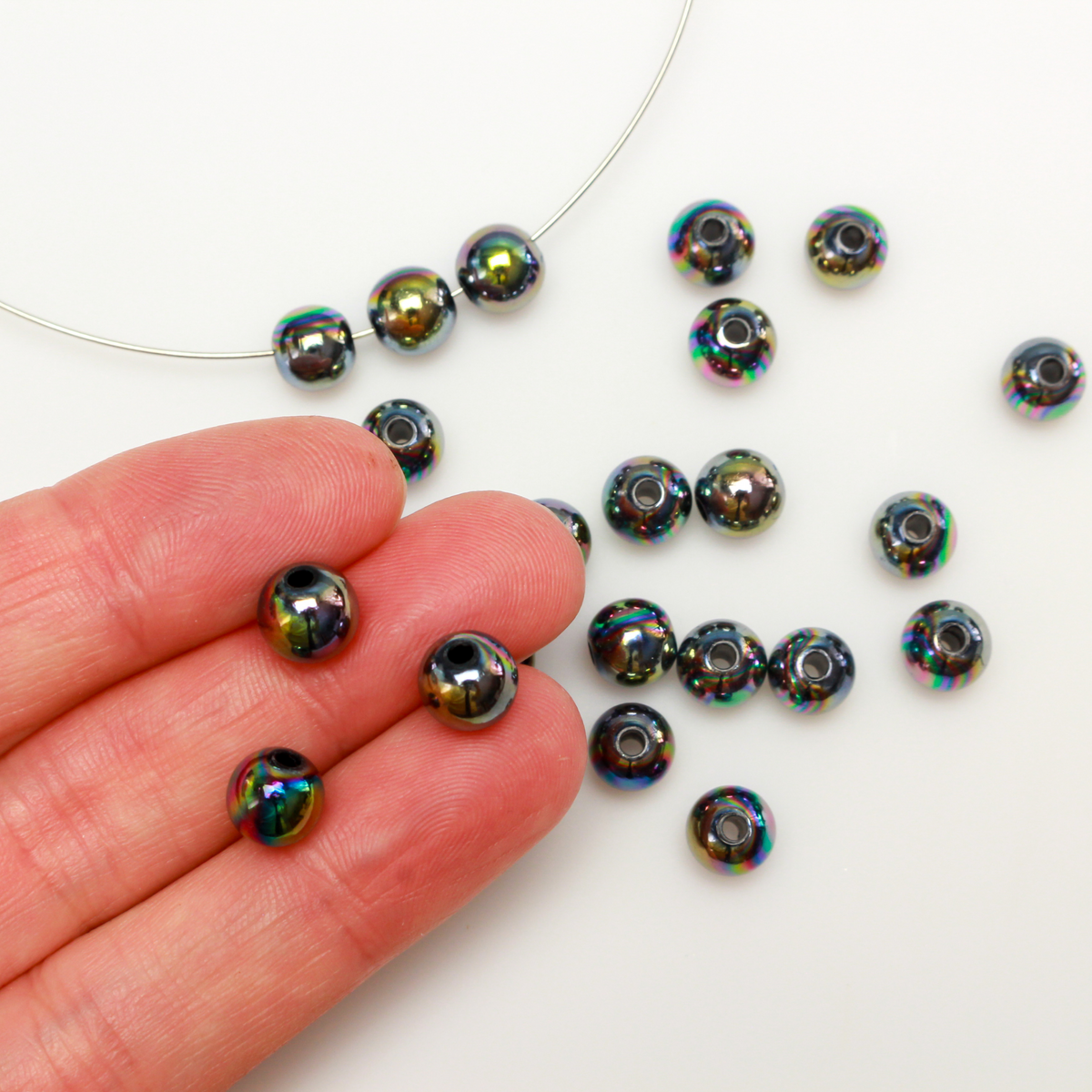 Acrylic AB (aurora borealis) color plated opaque black beads, 8mm round