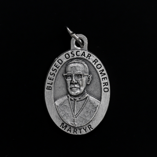 Blessed Óscar Romero medal that depicts the saint on the front and the reverse side is marked "Pray For Us"