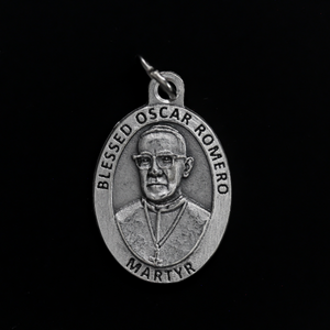 Blessed Óscar Romero medal that depicts the saint on the front and the reverse side is marked "Pray For Us"