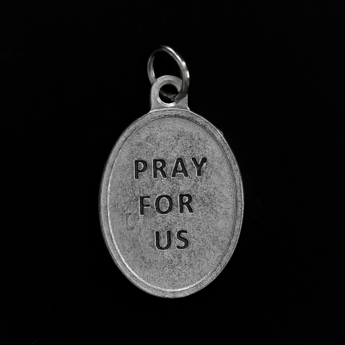 Blessed Óscar Romero medal that depicts the saint on the front and the reverse side is marked "Pray For Us"