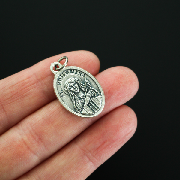 Saint John Vianney aka Curé d'Ars medal that has Saint Philomena on the reverse side