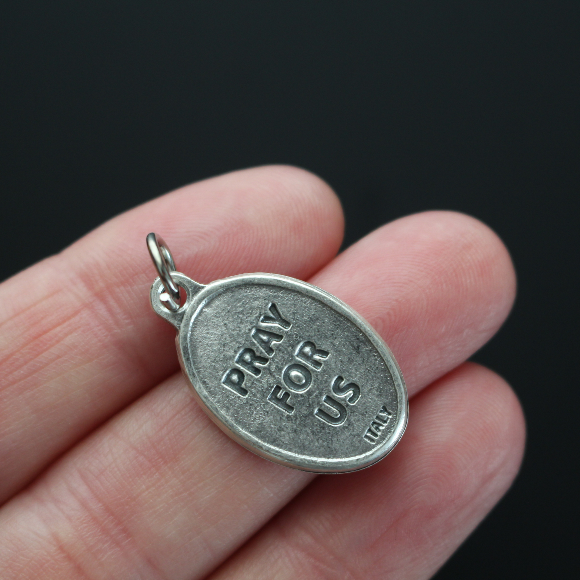 Edith Stein, also known as, Saint Teresa Benedicta of the Cross medal that depicts the saint on the front and marked "Pray For Us" on the backside