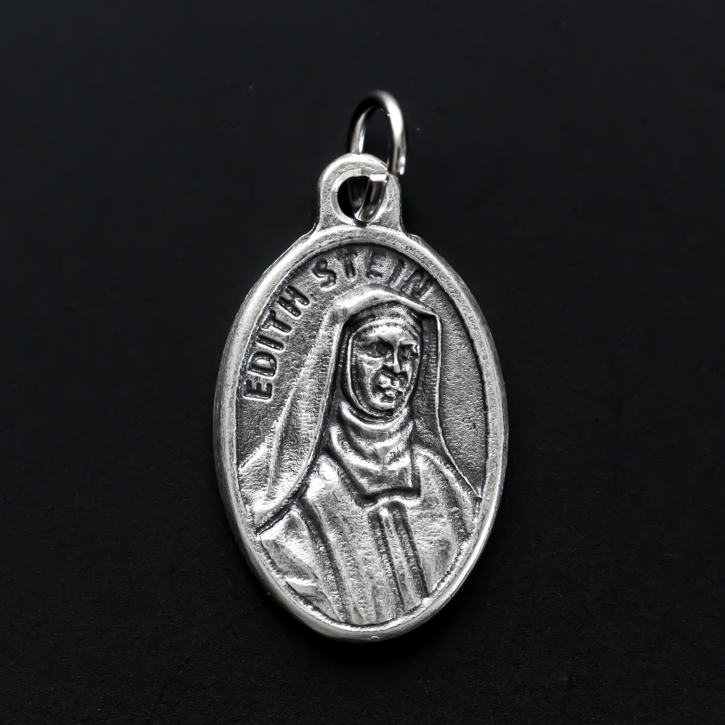 Edith Stein, also known as, Saint Teresa Benedicta of the Cross medal that depicts the saint on the front and marked "Pray For Us" on the backside