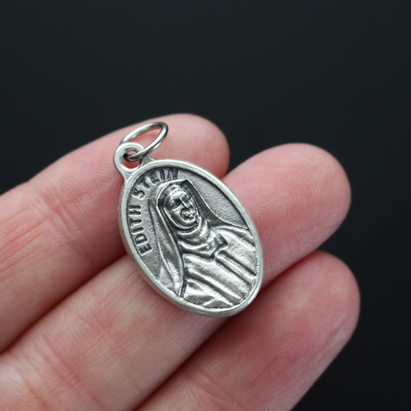 Edith Stein, also known as, Saint Teresa Benedicta of the Cross medal that depicts the saint on the front and marked "Pray For Us" on the backside