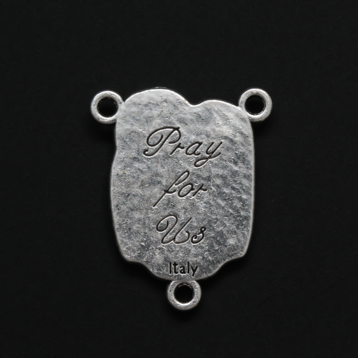 This rosary centerpiece features an image of the Holy Family on the front and "Pray For Us" on the back