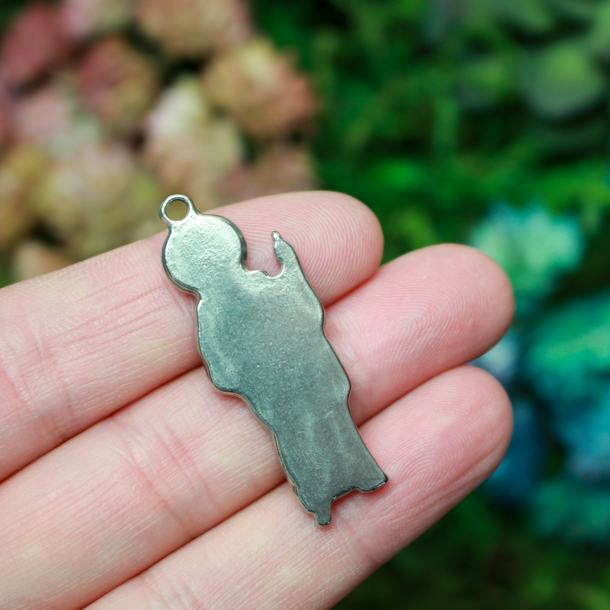 Jesus Christ figural charm pendant that depicts Jesus as the Good Shepherd holding a shepherd's staff., 1.5" long