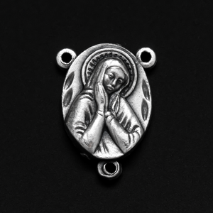 one inch long silver tone rosary centerpiece with the Blessed Virgin Mary on the front and the Sacred Heart of Jesus on the back