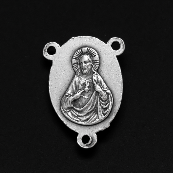 one inch long silver tone rosary centerpiece with the Blessed Virgin Mary on the front and the Sacred Heart of Jesus on the back