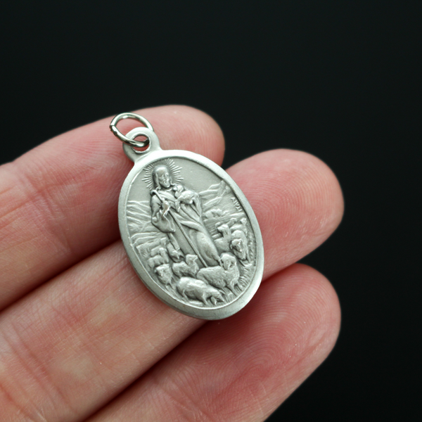 Jesus Christ depicted as the good shepherd, 0ne inch oval die-cast medal made in Italy