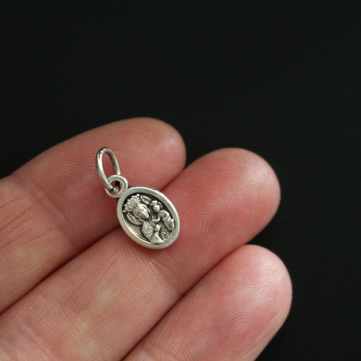 St. John Paul II mini medal that depicts the saint on the front and Our Lady of Perpetual Help on the back