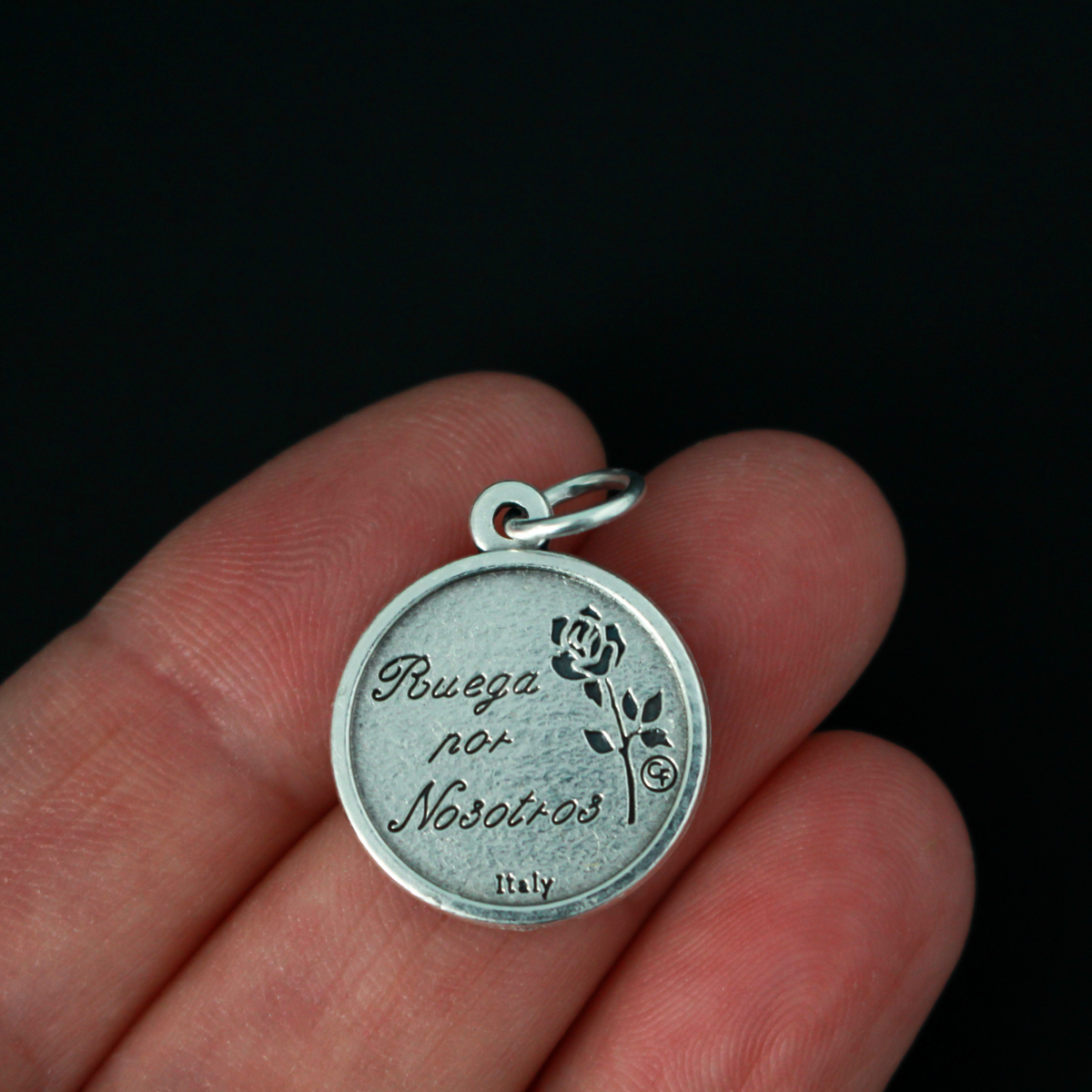 Saint José Gabriel del Rosario Brochero medal. The front depicts the saint and the reverse is marked "Pray For Us" in Spanish: Ruega Por Nosotros