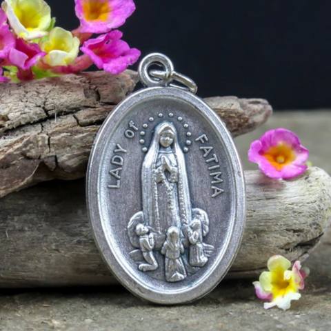 our lady of fatima silver-tone die-cast medal