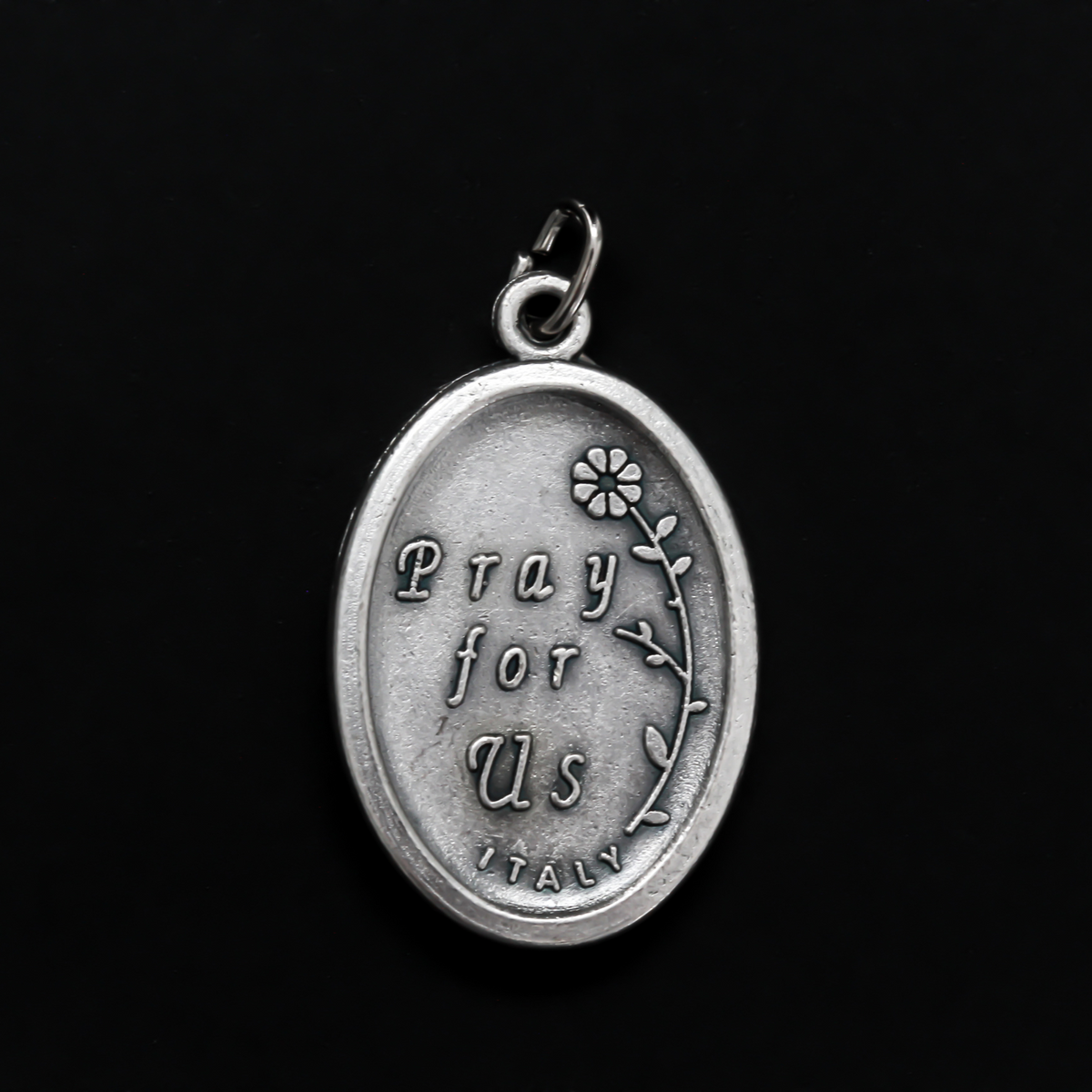 Our Lady of Loreto or Our Lady of Lauretana medal. The front depicts Our Lady and the reverse is marked "Pray For Us"