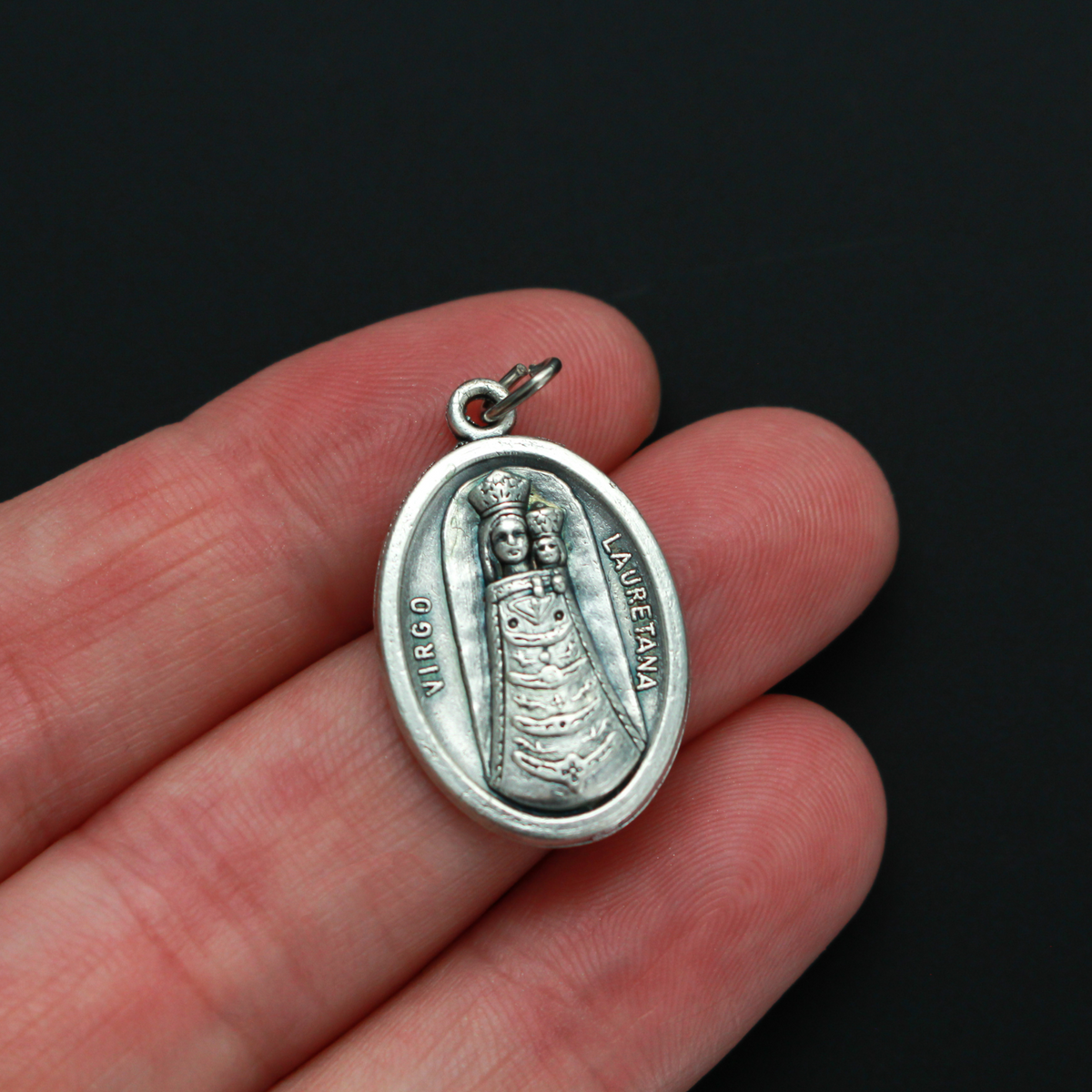 Our Lady of Loreto or Our Lady of Lauretana medal. The front depicts Our Lady and the reverse is marked "Pray For Us"