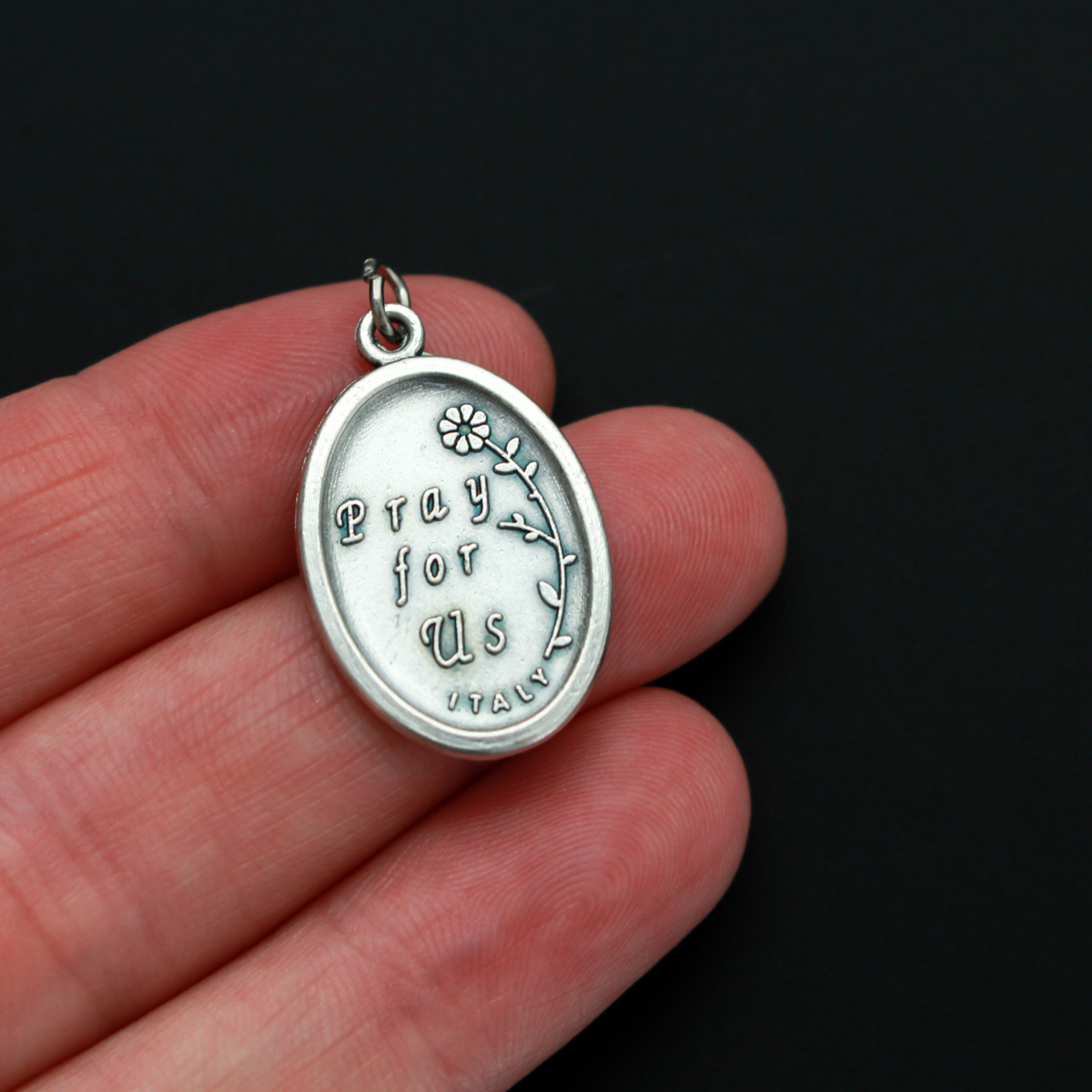 Our Lady of Loreto or Our Lady of Lauretana medal. The front depicts Our Lady and the reverse is marked "Pray For Us"