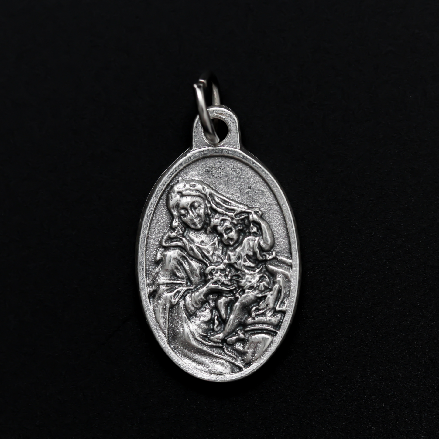 Our Lady of the Grapes medal that depicts Our Lady on the front and the words "Madonna of the Grapes Pray For Us" on the back.