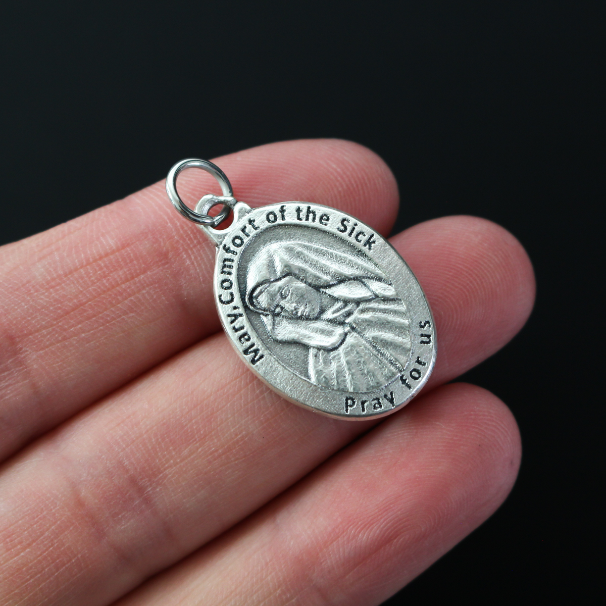 Mary, Comfort of the Sick medal with the Holy Infant Jesus of Good Health on the backside