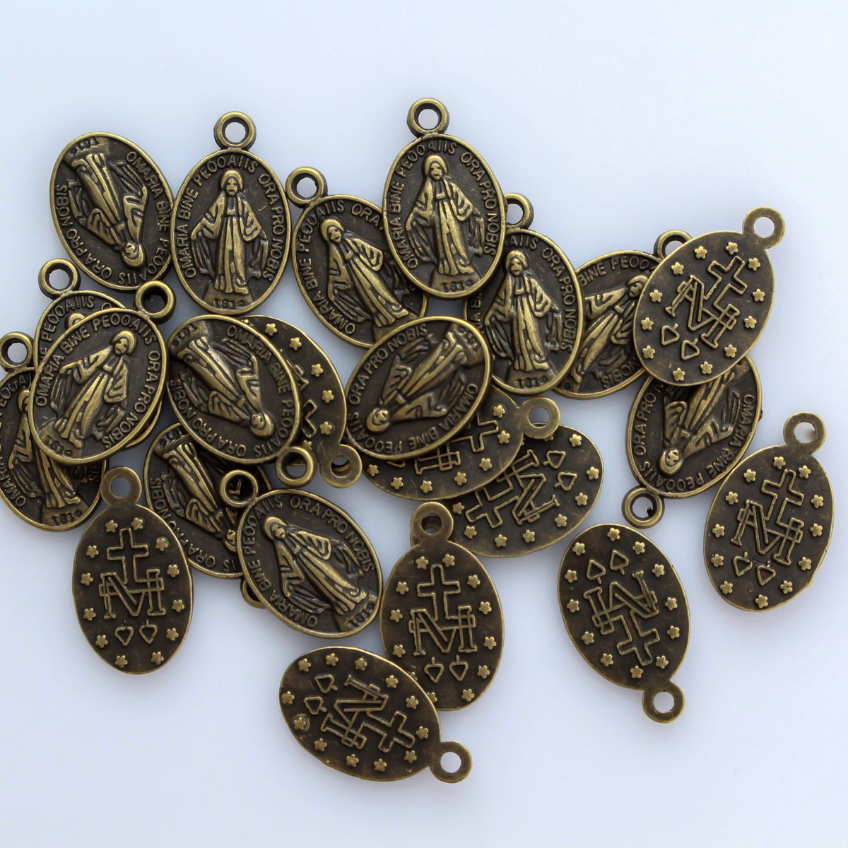 Bronze Miraculous Mary medal with the Latin inscription"O' Maria Sine Peccatis Ora Pro Nobis"
