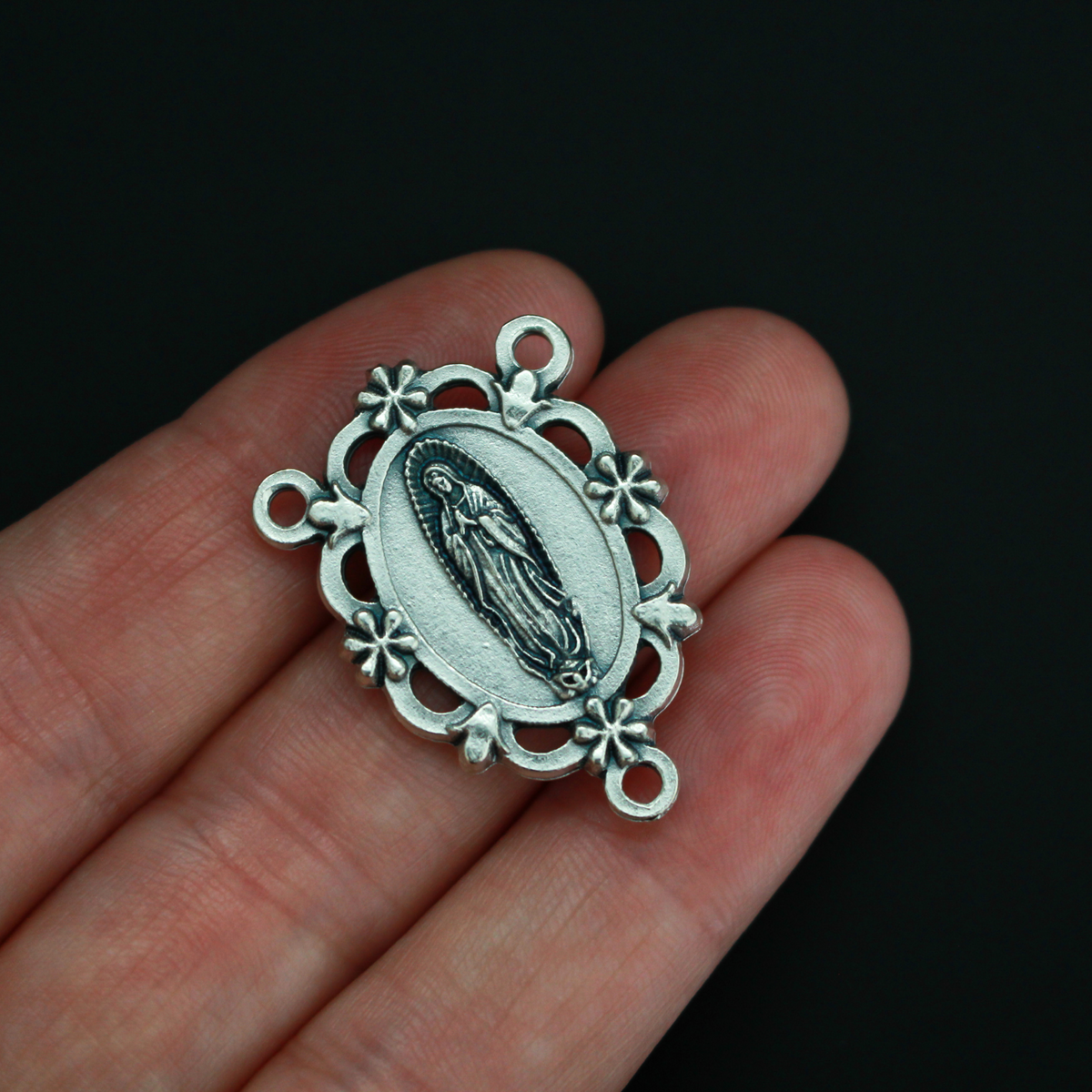 Our Lady of Guadalupe rosary centerpiece with filigree cut out design and floral detailing