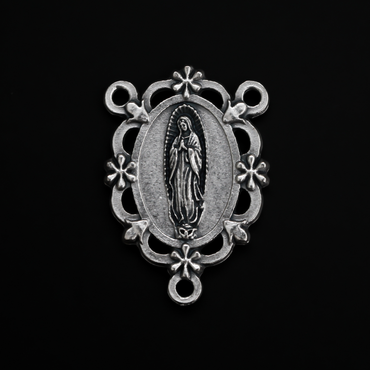 Our Lady of Guadalupe rosary centerpiece with filigree cut out design and floral detailing