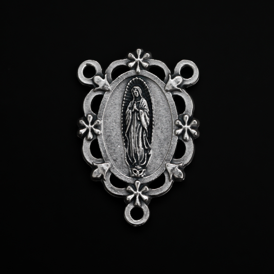 Our Lady of Guadalupe rosary centerpiece with filigree cut out design and floral detailing