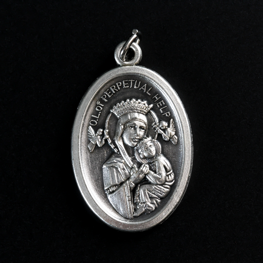 Our Lady of Perpetual Help medal. The reverse side of the medal is inscribed with "Pray For Us"